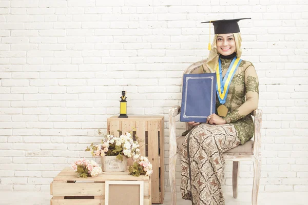 Indonesia female graduated student wearing traditional clothes