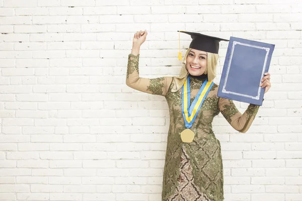 Success of graduated indonesian female student wearing tradition