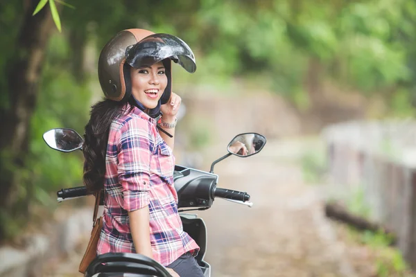 Woman riding motorcycle