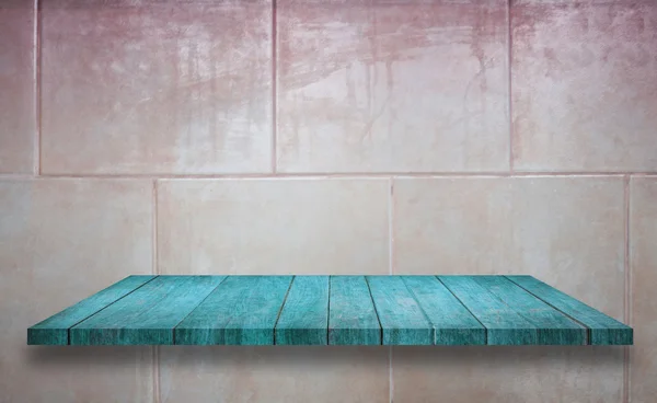 Top of blue wooden shelf on ceramic tiles wall texture backgroun