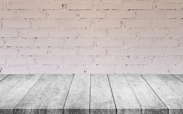 Black and white wooden table top with white brick wall