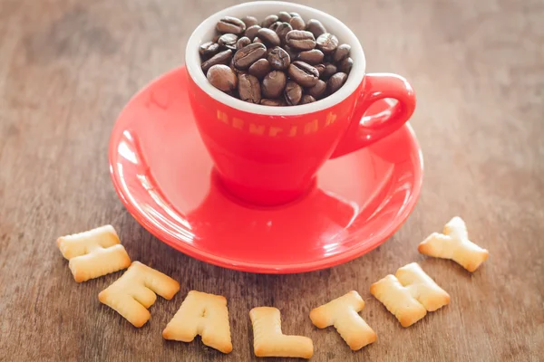 Healthy alphabet biscuit with red coffee cup