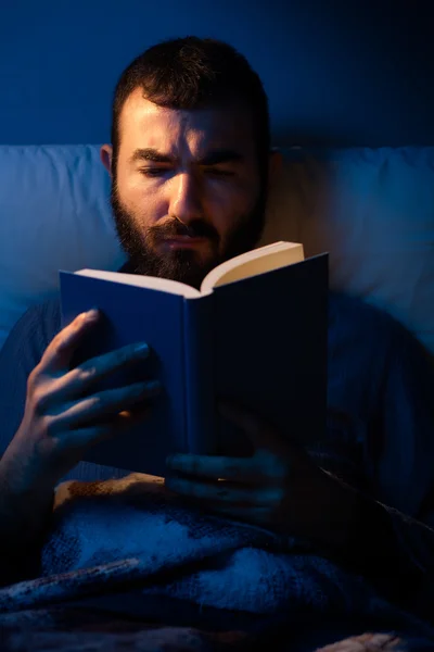 Man Reading at Night