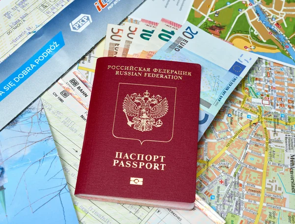 Russian passport and Euro banknotes on the map background