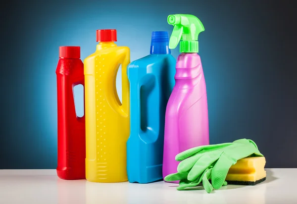 Colorful cleaning equipment and blue background