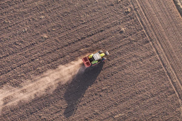 Aerial view of harvest fields with tractor