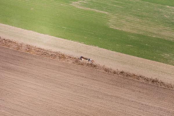 Harvest fields with tractor