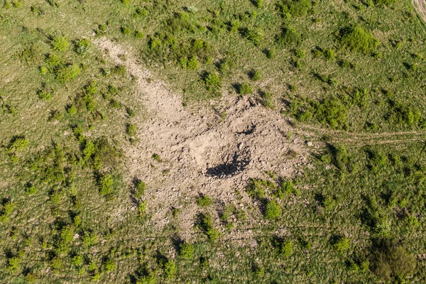 Aerial view of bomb explosion crater