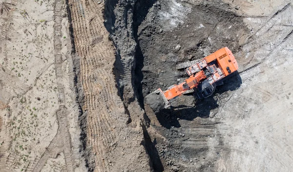 Aerial view of the earth mover in the quarry