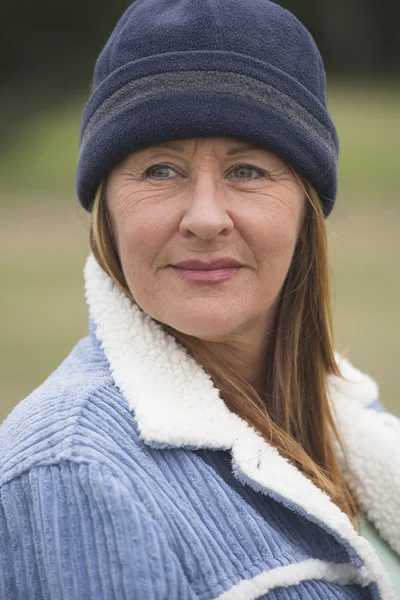 Confident mature woman bonnet portrait