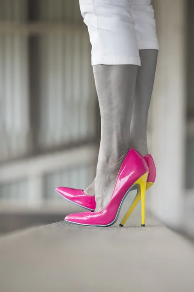 Close up high heel shoes standing woman filtered