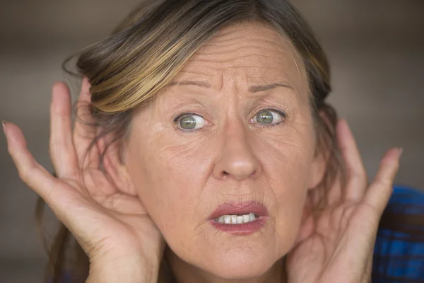 Woman listening interested to sound and noises