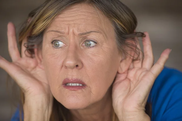 Woman listening anxious to sound and noises