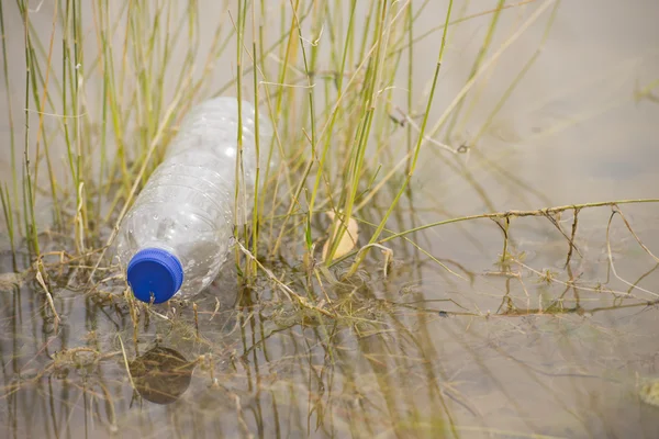 Plastic bottle garbage disposed in river water