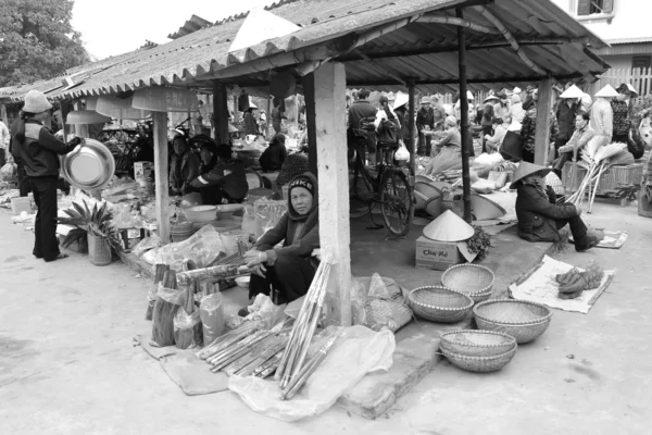 Asian woman selling incense in the market