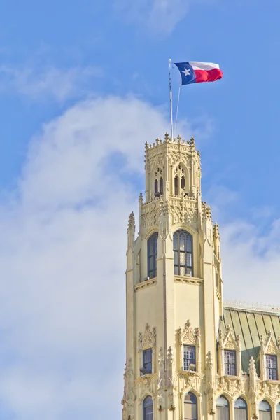 Texas flag over building