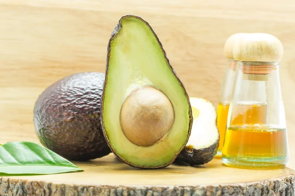 Avocado oil on wood background