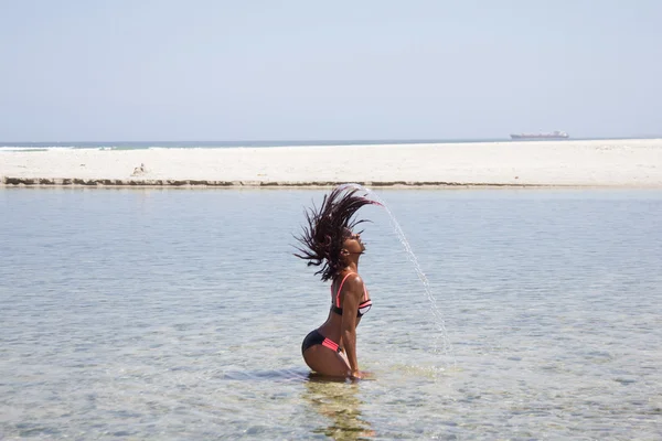 Action Shot: African Bikini Model Flipping Her Hair Back