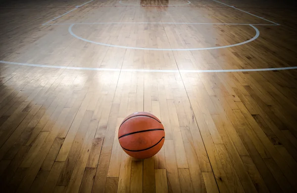 Basketball ball over floor