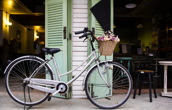 Vintage bicycle on vintage wooden