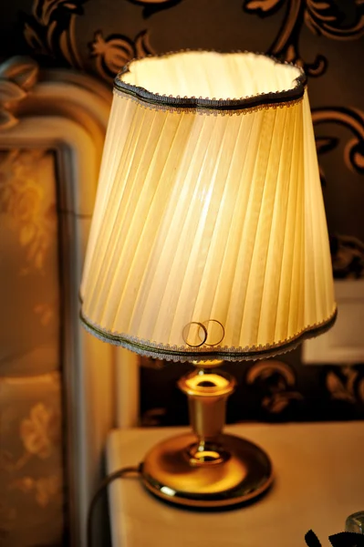 Lamp on the bedside table in bedroom