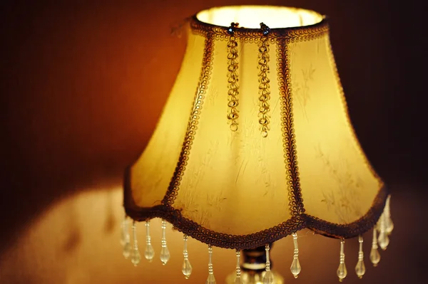 Lamp on the bedside table in bedroom