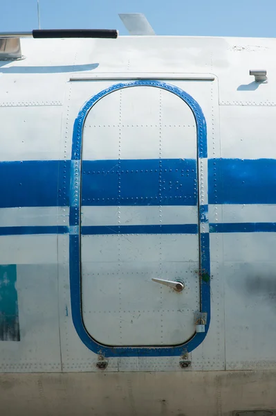 Old blue painted aircraft door close up