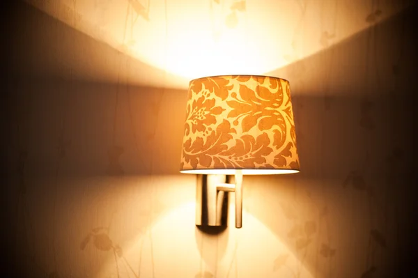 Lamp on a wall shining.