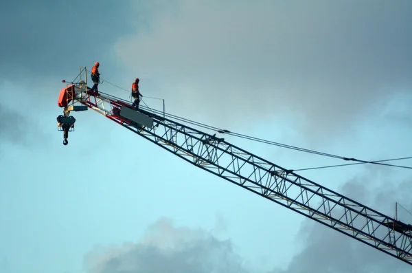 Crane driver operators walks on a tower crane