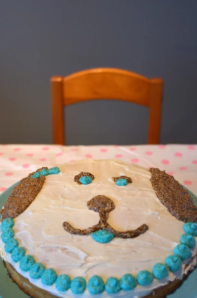 Homemade birthday cake in a shape of a dog face