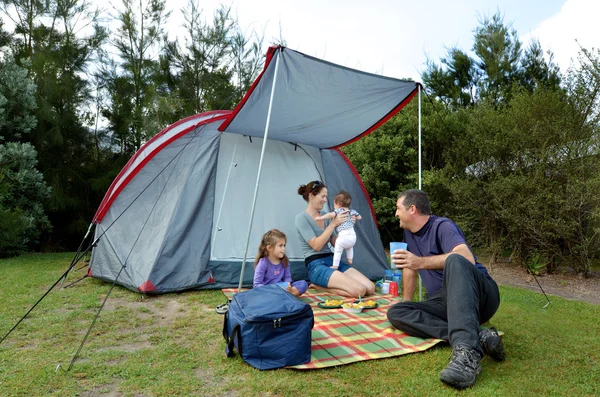 Family camping in a tent outdoors