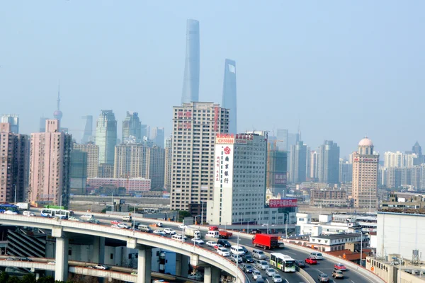 Traffic against Shanghai cityscape