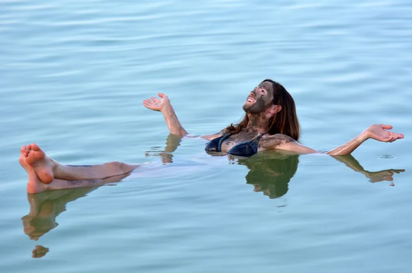 Young Woman floating on the Dead Sea, Israel