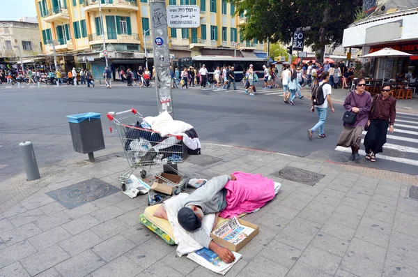 Homeless sleep in the street in Tel Aviv