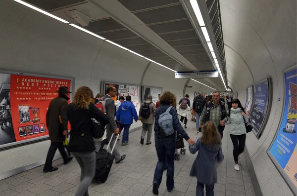 Passengers travel in  London Underground station