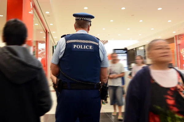 New Zealand police officers patrol in a mall in Auckland