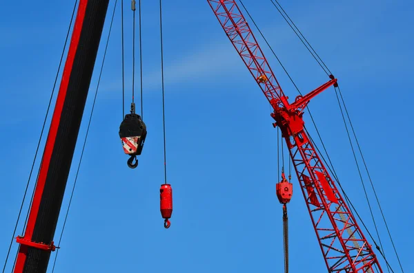 Red cranes in construction site