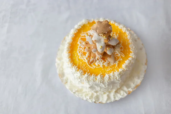 Birthday cake with whipped cream and biscuits