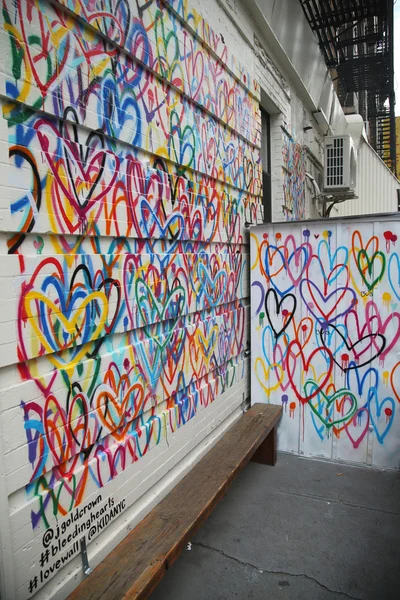 Bleeding Hearts Lovewall mural by artist JGoldcrown in Soho in Manhattan.