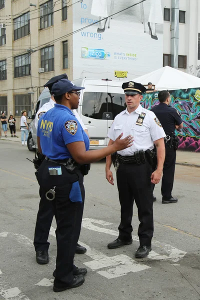NYPD and Community Affairs officer providing security at Hip Hop concert