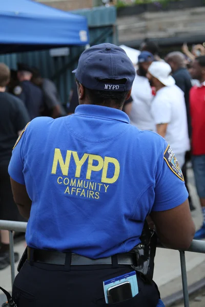 Community Affairs officer providing security at Hip Hop concert