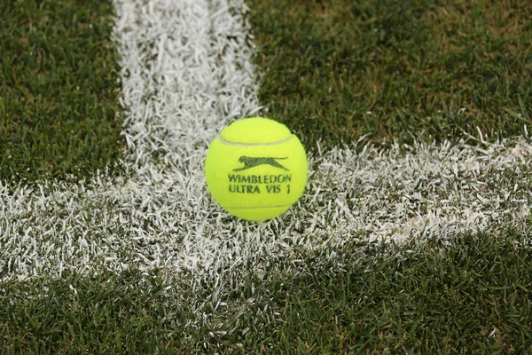 Slazenger Wimbledon Tennis Ball on grass tennis court