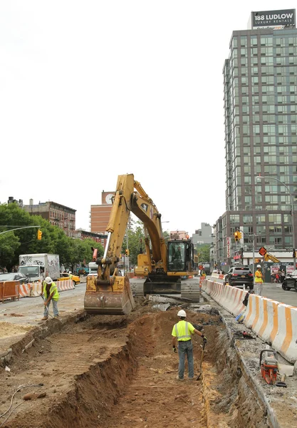 Constriction workers repair street in Lower Manhattan