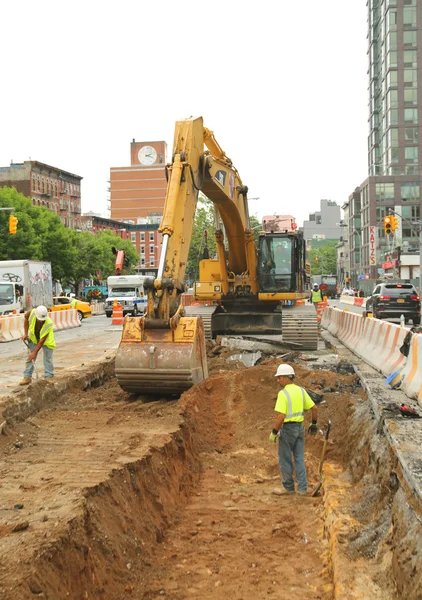 Constriction workers repair street in Lower Manhattan