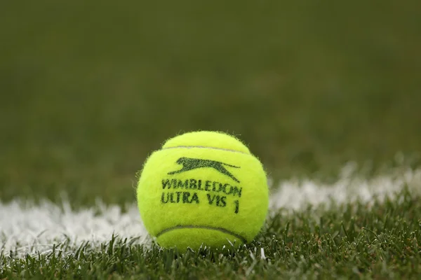 Slazenger Wimbledon Tennis Ball on grass tennis court