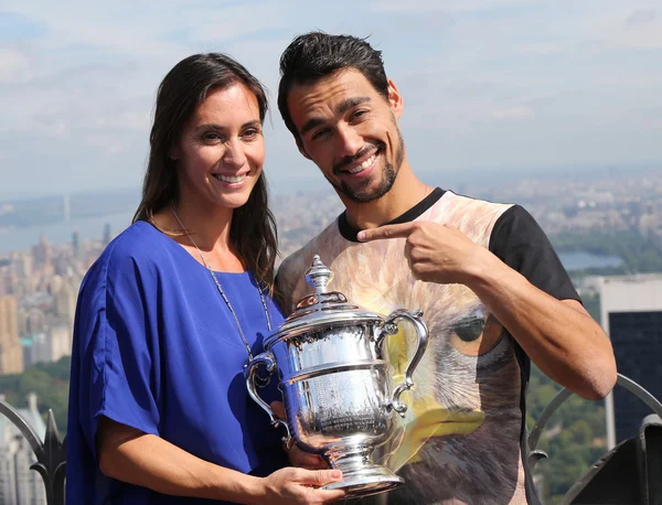 US Open 2015 champion Flavia Pennetta and tennis player Fabio Fognini posing with US Open trophy on the Top of the Rock Observation Deck