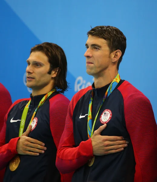 USA Men\'s 4x100m medley relay team  Cory Miller (L) and  Michael Phelps celebrate victory at the Rio 2016 Olympic Games at the Olympic Aquatics Stadium