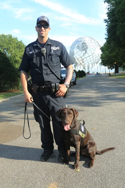 NYPD transit bureau K-9 police officer and K-9 dog providing security at National Tennis Center