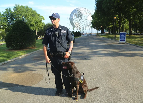 NYPD transit bureau K-9 police officer and K-9 dog providing security at National Tennis Center