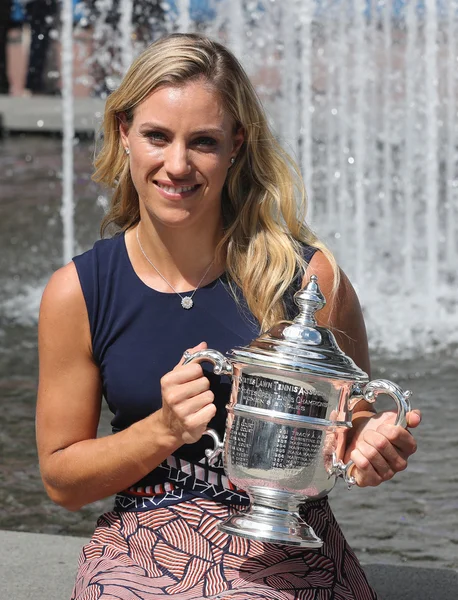 Two times Grand Slam champion Angelique Kerber of Germany posing with US Open trophy after her victory at US Open 2016